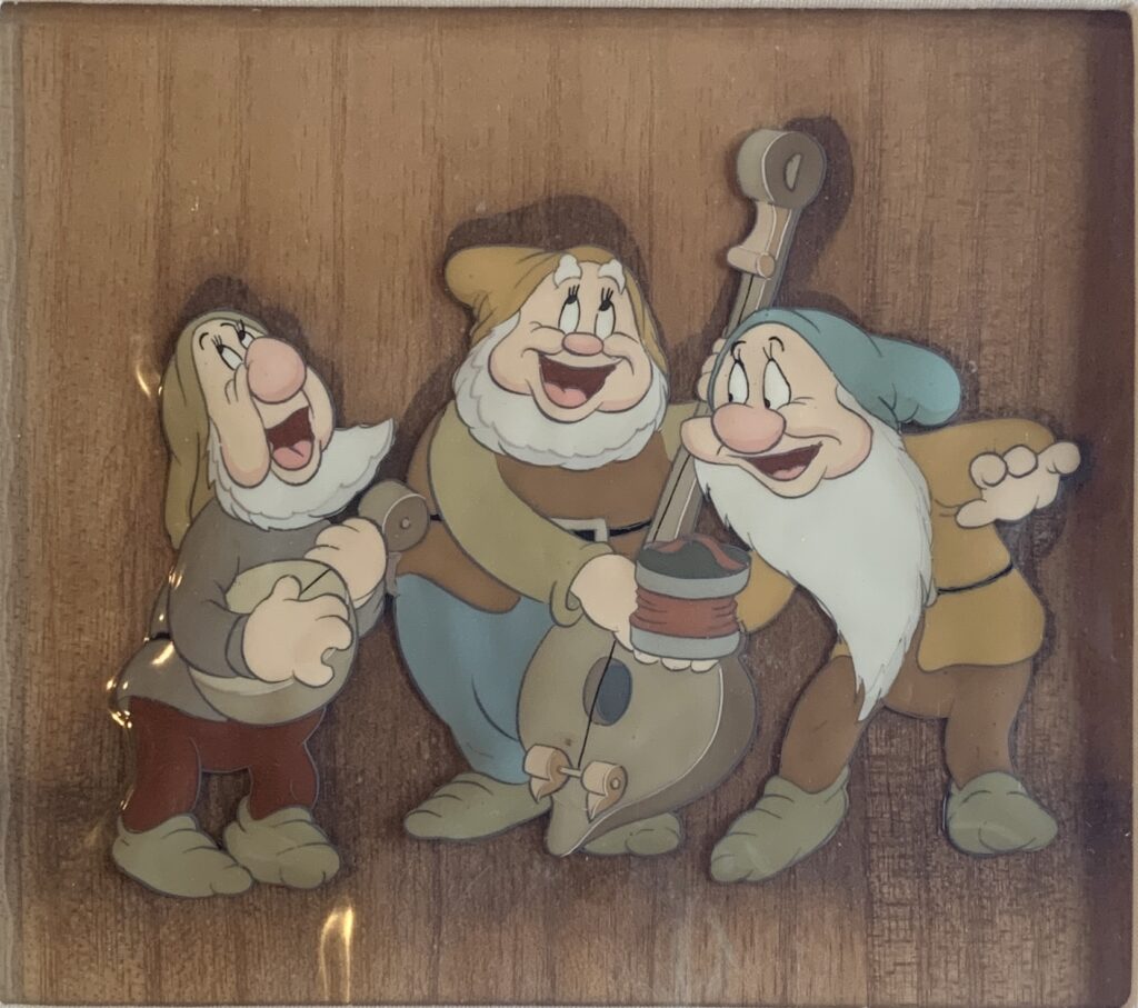 Happy, Bashful, Sneezy from Snow White and the Seven Dwarfs, 1937 original production cel, Courvoisier background $7950.00