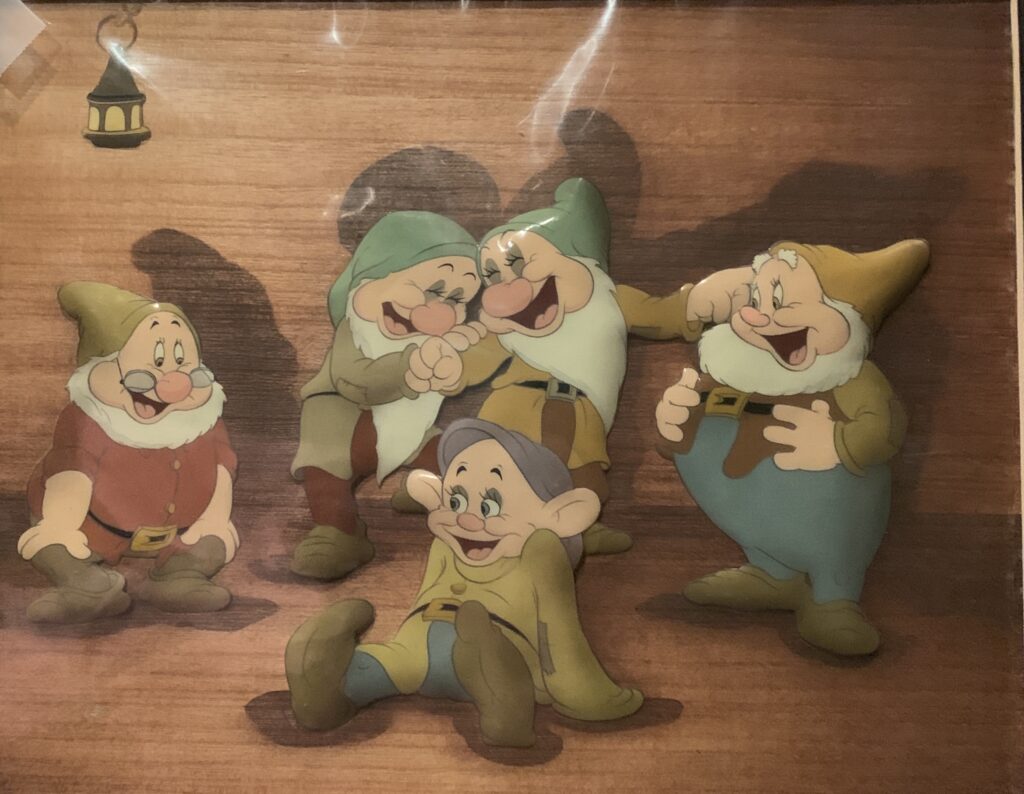 Dopey, Sleepy, Happy, Bashful, and Doc from Snow White and the Seven Dwarfs, 1937 original production cel, Courvoisier background $15,500.00